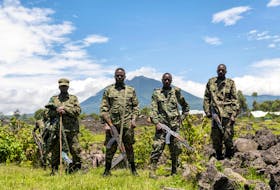 Members of the Ugandan army, part of the troops to the East Africa Community Regional Force (EACRF), stand at a settlement ceded by M23 rebels fighters to EACRF soldiers in Bunagana, Rutshuru territory of the North Kivu province of the Democratic Republic of Congo April 19, 2023.