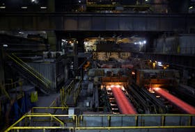 Red hot slabs of steel move along conveyors at the ArcelorMittal metals plant in Dunkirk as part of a media tour dedicated to the reduction of carbon intensity of the industry in France, January 16, 2023.