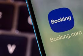Booking.com app is seen on a smartphone in this illustration taken February 27, 2022.