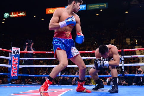 Nov 2, 2019; Las Vegas, NV, USA; Ryan Garcia (blue trunks) knocks out Romero Duno (black trunks) during their WBC silver and NABO lightweight title bout at MGM Grand Garden Arena. Mandatory Credit: Joe Camporeale-USA TODAY Sports