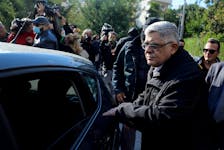 Leader of the far-right Golden Dawn party Nikos Mihaloliakos is escorted as he leaves his home, after the party was declared a criminal organisation by a court in Athens, Greece, October 22, 2020.