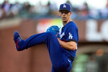 Jun 10, 2022; San Francisco, California, USA; Los Angeles Dodgers starting pitcher Walker Buehler (21) delivers a pitch against the San Francisco Giants during the second inning at Oracle Park. Mandatory Credit: D. Ross Cameron-USA TODAY Sports/File Photo