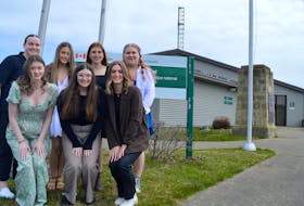 Members of the Glace Bay High School Interact Club stand outside the Marconi National Historic Site in the Table Head neighbourhood of Glace Bay on Tuesday. The group — front, from left, Holly Wells, Mya MacKinnon and Cloe Maxner; and back, from left, Katie Poirier, Grace Halfyard, Mya McFadgen and Olivia Wheaton — won $2,000 for their presentation on the work of Guglielmo Marconi. Chris Connors/Cape Breton Post
