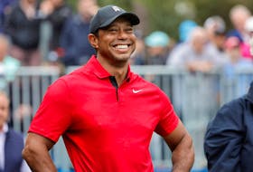 Dec 17, 2023; Orlando, Florida, USA;  Tiger Woods smiles before he plays his shot from the first tee during the PNC Championship at The Ritz-Carlton Golf Club. Mandatory Credit: Reinhold Matay-USA TODAY Sports/File Photo