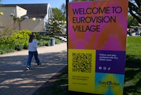 A person walks past a sign of the Eurovision Song Contest in Malmo, Sweden, May 1, 2024.