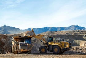 A wheel loader operator fills a truck with ore at the MP Materials rare earth mine in Mountain Pass, California, U.S. January 30, 2020.  