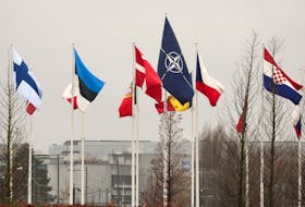 Flags fly outside NATO headquarters, before a meeting of NATO foreign ministers, in Brussels, Belgium November 27, 2023.
