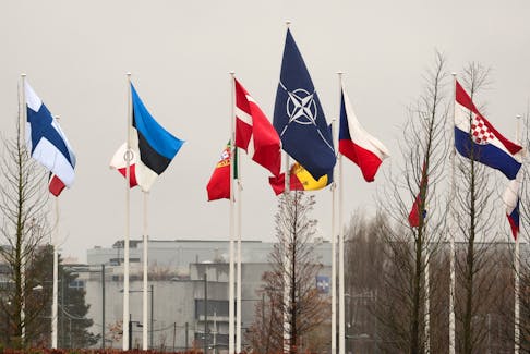 Flags fly outside NATO headquarters, before a meeting of NATO foreign ministers, in Brussels, Belgium November 27, 2023.