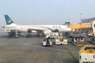 View of a Pakistan International Airlines (PIA) passengers plane, taken through a glass panel, at the Allama Iqbal International Airpor in Lahore, Pakistan January 29, 2024.