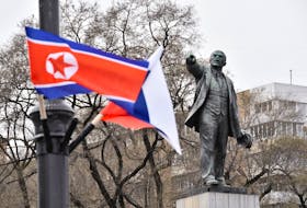 State flags of Russia and North Korea fly in a street near a monument to Soviet state founder Vladimir Lenin during the visit of North Korea's leader Kim Jong Un to Vladivostok, Russia April 25, 2019.