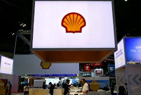 Staff members work at the booth of Royal Dutch Shell at Gastech, the world's biggest expo for the gas industry, in Chiba, Japan, April 4, 2017.   