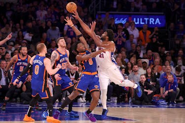 Apr 30, 2024; New York, New York, USA; Philadelphia 76ers center Joel Embiid (21) shoots against New York Knicks forward OG Anunoby (8) and center Isaiah Hartenstein (55) and guards Donte DiVincenzo (0) and Jalen Brunson (11) during the third quarter of game 5 of the first round of the 2024 NBA playoffs at Madison Square Garden. Mandatory Credit: Brad Penner-USA TODAY Sports