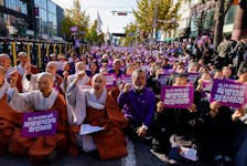 Clerics and families of victims who have died in the Halloween crowd crush a year ago, shout slogans during a rally to commemorate one year anniversary of deadly Halloween crowd crush, at Seoul City Hall Plaza in Seoul, South Korea, October 29, 2023.