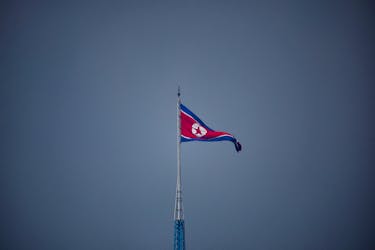 A North Korean flag flutters at the propaganda village of Gijungdong in North Korea, in this picture taken near the truce village of Panmunjom inside the demilitarized zone (DMZ) separating the two Koreas, South Korea, July 19, 2022.   