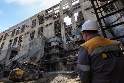 Thermal power plant employee appears on site at the building damaged by recent Russian missile strikes, amid Russia's attack on Ukraine, at an undisclosed location in the west of Ukraine May 2, 2024.