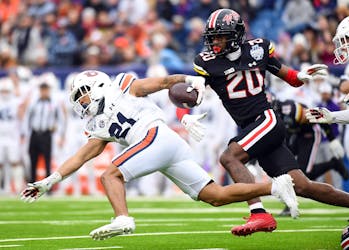 Dec 30, 2023; Nashville, TN, USA; Auburn Tigers running back Brian Battie (21) is tackled after returning a kickoff during the first half against the Maryland Terrapins at Nissan Stadium. Mandatory Credit: Christopher Hanewinckel-USA TODAY Sports/File Photo