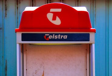 A public phone booth displaying the logo for Telstra Corp Ltd, Australia's biggest telecommunications company, stands outside the Cooladdi Post Office and motel, located in the town of Cooladdi in southwestern Queensland, Australia, August 14, 2017. Picture taken August 14, 2017.  
