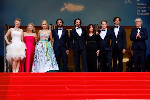 Director Ali Abbasi, producers Amy Baer, Louis Tisne, Julianne Forde and Ruth Treacy, cast members Maria Bakalova, Sebastian Stan and Martin Donovan, and Gabriel Sherman pose on the red carpet during arrivals for the screening of the film "The Apprentice" in competition at the 77th Cannes Film Festival in Cannes, France, May 20, 2024.