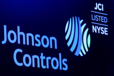The logo and trading symbol for Johnson Controls International is displayed on a board on the floor of the New York Stock Exchange (NYSE) in New York, U.S., October 16, 2018.
