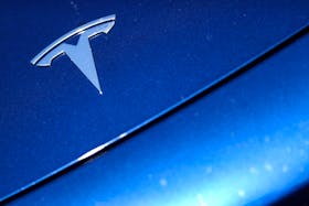 The Tesla logo is seen on a car in Los Angeles, California, U.S., July 9, 2020. 