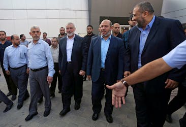 Hamas Gaza Chief Yahya Al-Sinwar, Hamas Chief Ismail Haniyeh and senior Hamas leader Khalil al-Hayya arrive at the Rafah border crossing in the southern Gaza Strip September 19, 2017.
