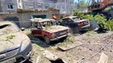 A view shows a destroyed building and cars following what local Russian-installed authorities called a Ukrainian military strike in the settlement of Yubileiny in the Luhansk region, Russian-controlled Ukraine, in this still image from video released May 20, 2024. Leonid Pasechnik Telegram channel/Handout via REUTERS
