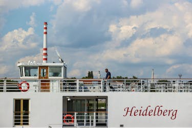 A man walks on the river cruise ship 'Heidelberg', following a deadly accident due to a suspected collision involving a small motor boat and a river cruise ship on the Danube River north of Budapest, in Komarom, Hungary, May 19, 2024.