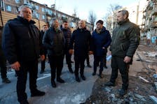 International Criminal Court (ICC) Prosecutor Karim Khan visits the site of a residential building damaged by a Russian missile strike late November, amid Russia's attack on Ukraine, in the town of Vyshhorod, outside Kyiv, Ukraine, February 28, 2023.