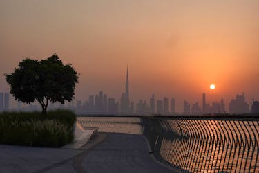 FILE PHOTO:The Burj Khalifa building peaks through the skyline as the sun sets over Dubai, United Arab Emirates, September 9, 2023.