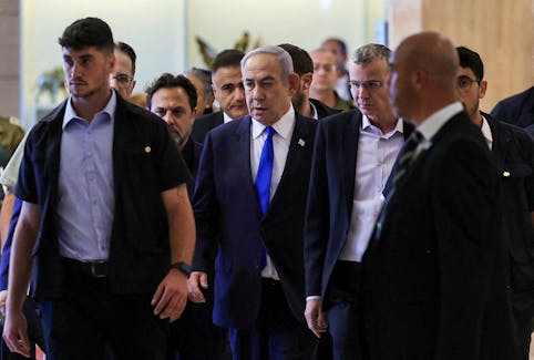 Israeli Prime Minister Benjamin Netanyahu arrives to his Likud party faction meeting at the Knesset, Israel's parliament, in Jerusalem May 20, 2024