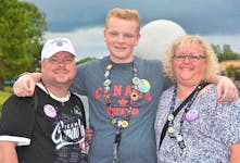 Lucas Rushton with his parents Lewis and Laureen. Laureen’s hope in telling Lucas’ story is that it helps another youth, another family, find the help and supports they need to deal with mental illness. Contributed
