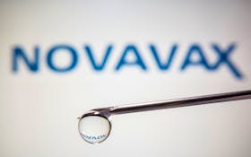 A Novavax logo is reflected in a drop on a syringe needle in this illustration taken November 9, 2020.