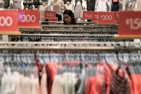 A woman shops inside a department store in central Bangkok, Thailand, December 22, 2016.