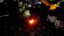 A car is seen lit on fire, amid protests against plans to allow more people to take part in local elections in the French-ruled territory, which indigenous Kanak protesters reject, in Noumea, New Caledonia May 18, 2024 in this screengrab from video obtained by Reuters. Video Obtained by Reuters/via REUTERS /File Photo