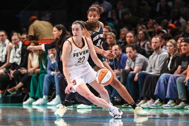 May 18, 2024; Brooklyn, New York, USA;  Indiana Fever guard Caitlin Clark (22) spins away from New York Liberty forward Nyara Sabally (8) in the fourth quarter at Barclays Center. / Wendell Cruz-USA TODAY Sports/File Photo