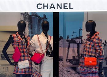 Chanel bags and creations are displayed on mannequins in a window of a fashion house Chanel store in Paris, France, June 18, 2020.