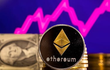 A representations of cryptocurrency Ethereum is seen in front of a stock graph and U.S. dollar in this illustration taken, January 24, 2022.