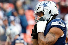 Jan 7, 2024; Landover, Maryland, USA; Dallas Cowboys linebacker Micah Parsons (11) adjusts his helmet during warmups prior to the game against the Washington Commanders at FedExField. Mandatory Credit: Geoff Burke-USA TODAY Sports