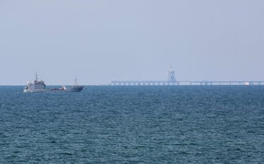 A ship loaded with aid sails near a U.S.-built pier, amid the ongoing conflict between Israel and the Palestinian Islamist group Hamas, as seen from central Gaza Strip, May 18, 2024.