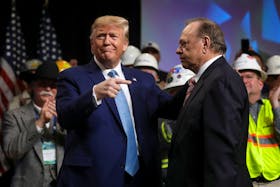 U.S. President Donald Trump greets Harold Hamm after he was introduced by Hamm at the Shale Insight 2019 Conference in Pittsburgh, Pennsylvania, U.S., October 23, 2019.