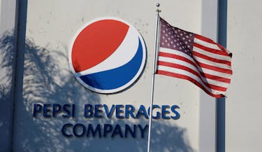 The Pepsi logo next to a U.S. flag is pictured in Irwindale, California, U.S., July 11, 2017.  