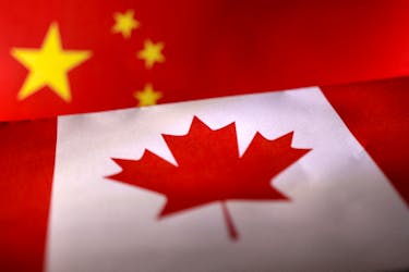 Printed Chinese and Canada flags are seen in this illustration, July 21, 2022.
