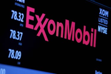 The logo of Exxon Mobil Corporation is shown on a monitor above the floor of the New York Stock Exchange in New York, December 30, 2015. 