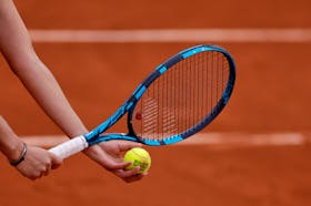 Tennis - French Open - Roland Garros, Paris, France - May 30, 2022  General view of Romania's Irina-Camelia Begu holding a tennis ball and her racket during her fourth round match against Jessica Pegula of the U.S.
