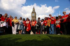 People impacted by the contaminated blood scandal participate in a minute of silence during a vigil to remember those that lost their lives, ahead of the release of final report of the Infected Blood Inquiry on Monday, in London, Britain, May 19, 2024.