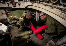 Ukrainian servicemen of the 92nd separate assault brigade load shells in an M109 self-propelled howitzer before firing towards Russian troops, amid Russia's attack on Ukraine, near the town of Vovchansk in Kharkiv region, Ukraine May 20, 2024.