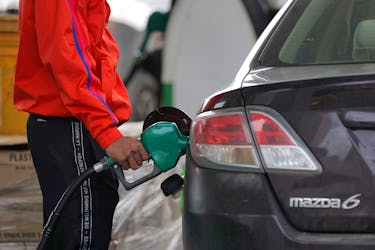 A person uses a petrol pump at a gas station as fuel prices surged in Manhattan, New York City, U.S., March 7, 2022.
