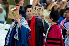 Graduates protest the conflict between Israel and the Palestinian Islamist group Hamas, during the commencement at Yale University, New Haven, Connecticut, U.S., May 20, 2024.