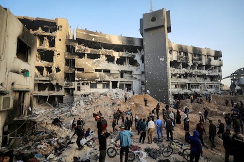 Palestinians inspect damages at Al Shifa Hospital after Israeli forces withdrew from the hospital and the area around it following a two-week operation, amid the ongoing conflict between Israel and Hamas, in Gaza City April 1, 2024.