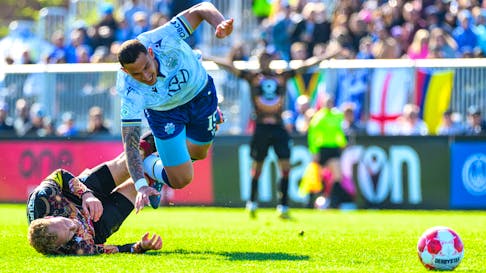 Tiago Coimbra of the Halifax Wanderers gets tripped up by a Valour FC defender during a Canadian Premier League match Monday afternoon at the Wanderers Grounds. The Wanderers lost 2-1 to fall to 0-4-1 on the season. - CANADIAN PREMIER LEAGUE